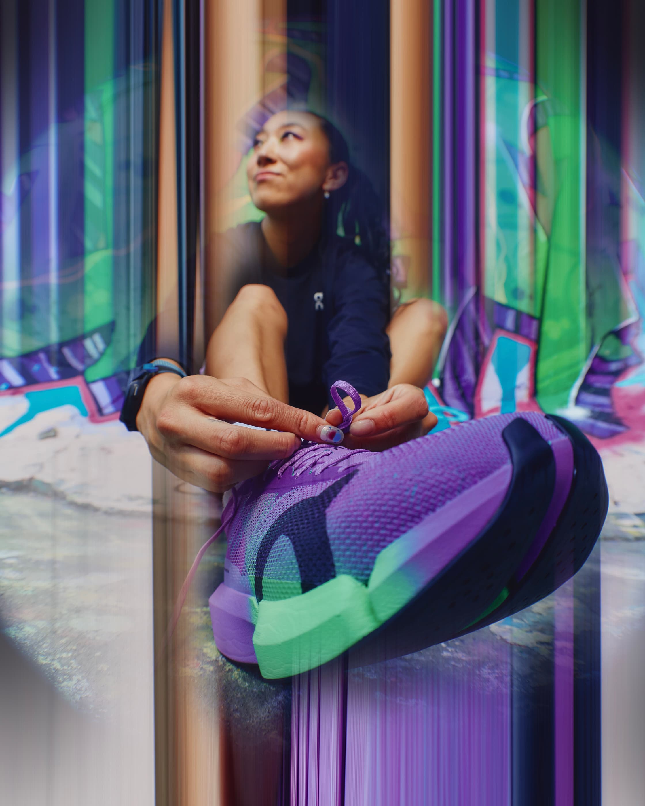 Runner lacing the purple On Cloudboom Strike 2